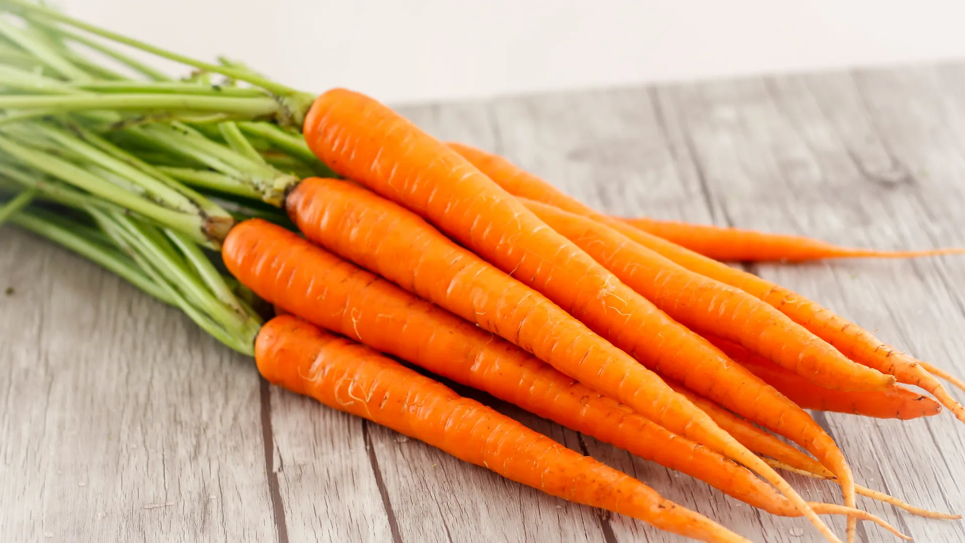 Carrots Close-up on a Wooden Background