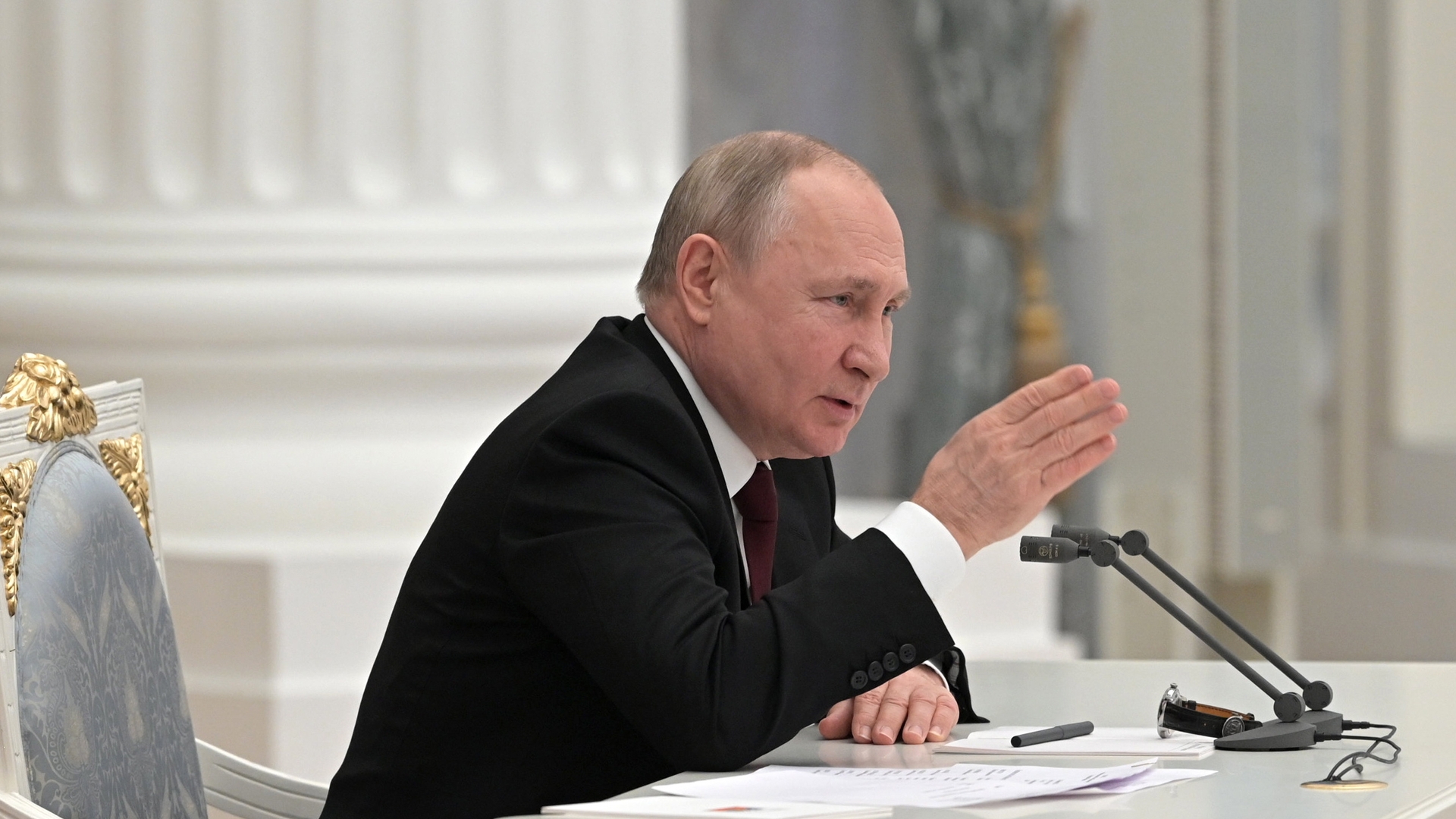 Russian President Vladimir Putin meets with members of the Security Council in Moscow